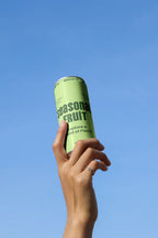 Design Studies: Slim Can Mockup CF32 – Held Upward, Blue Sky