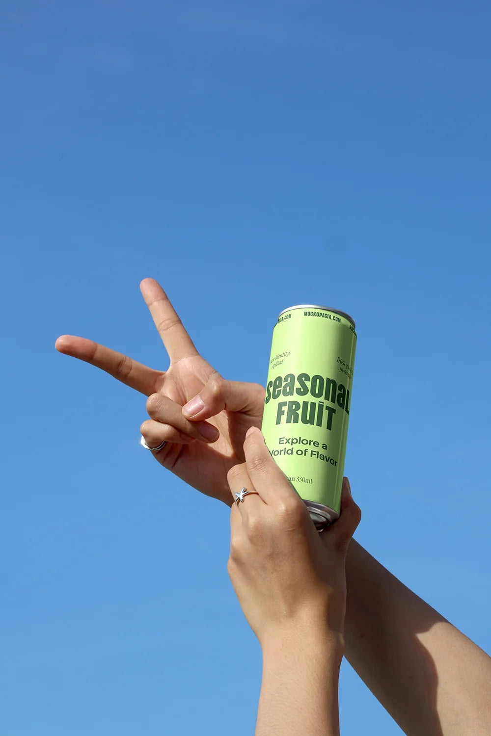 Design Studies: Slim Can Mockup CF10 – Held Against Blue Sky