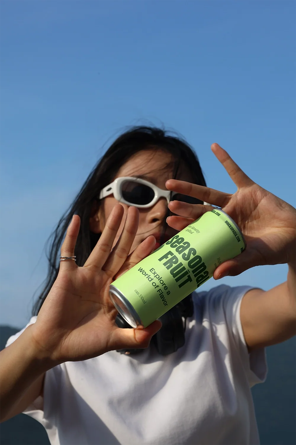 Design Studies: Slim Can Mockup CF28 – In Hand, Bright Sky